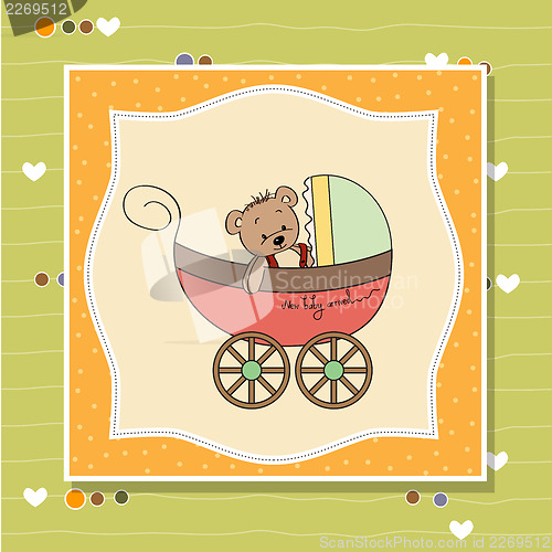 Image of funny teddy bear in stroller