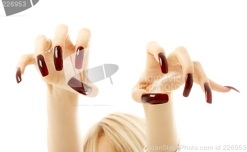 Image of aggressive girl hands with long acrylic nails