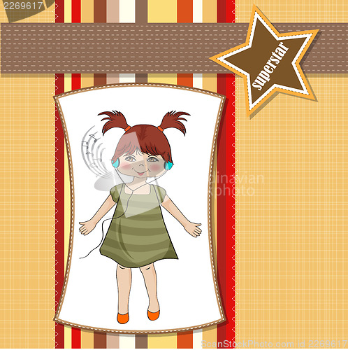 Image of young girl listening to music on headphones and dancing