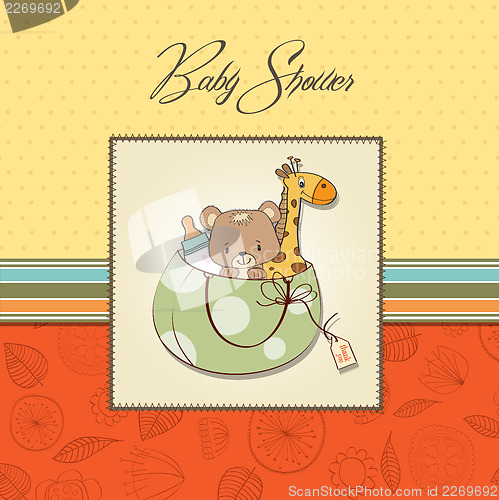 Image of new baby announcement card with bag and same toys