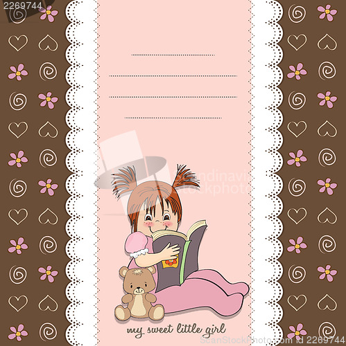 Image of sweet little girl reading a book