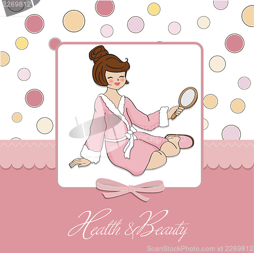 Image of spa lady who looks into a mirror