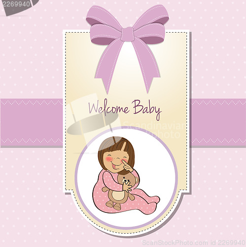 Image of little baby girl with her teddy bear toy