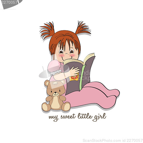 Image of sweet little girl reading a book