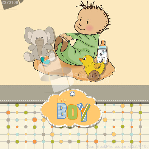 Image of little baby boy play with his toys