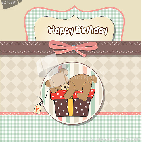 Image of birthday greeting card with teddy bear and big gift box