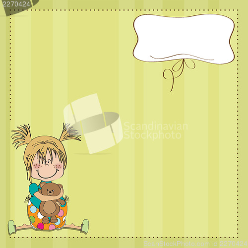 Image of little girl sitting with her teddy bear