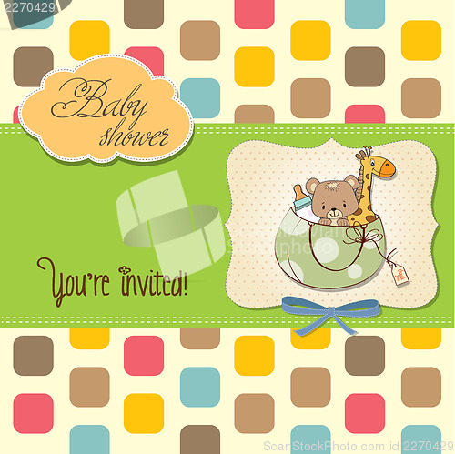 Image of new baby announcement card with bag and same toys