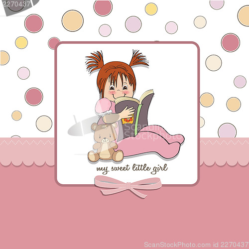 Image of sweet little girl reading a book