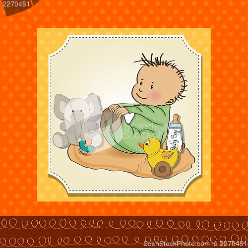 Image of little baby boy play with his toys
