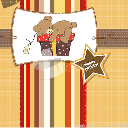 Image of birthday greeting card with teddy bear and big gift box