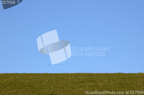 Image of grazing land and blue sky