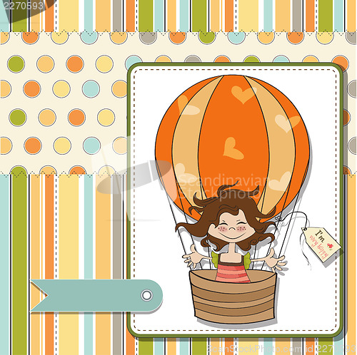 Image of happy girl flying with a balloon flying