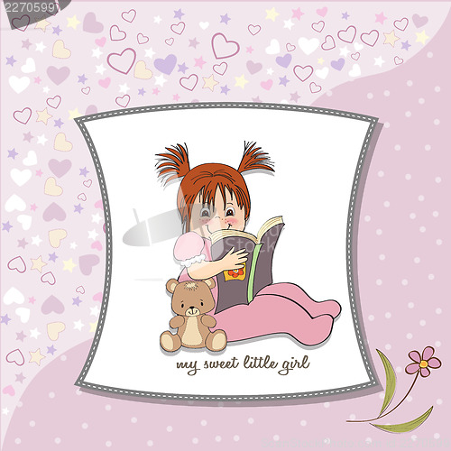 Image of sweet little girl reading a book