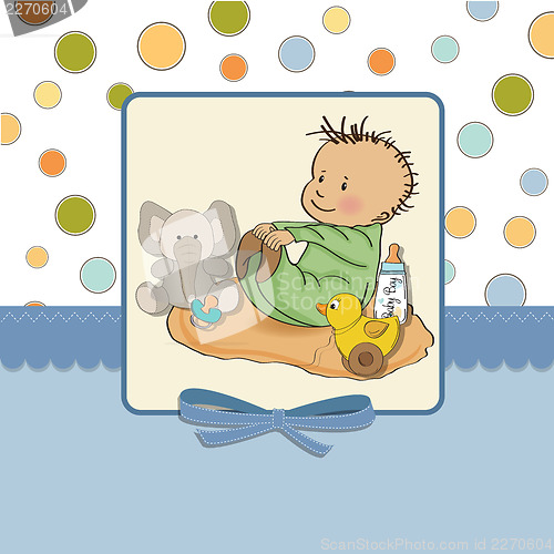Image of little baby boy play with his toys