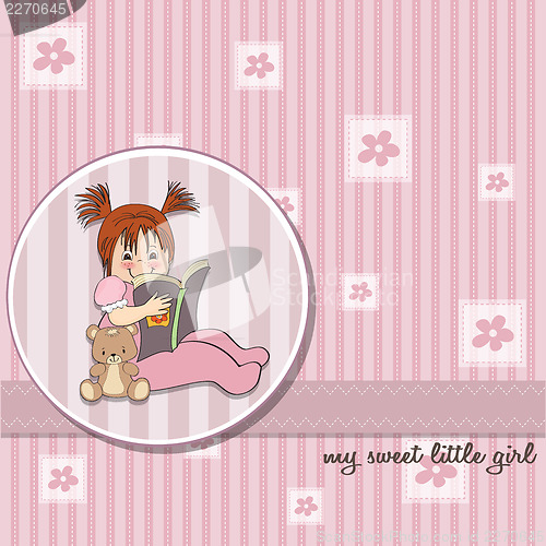 Image of sweet little girl reading a book