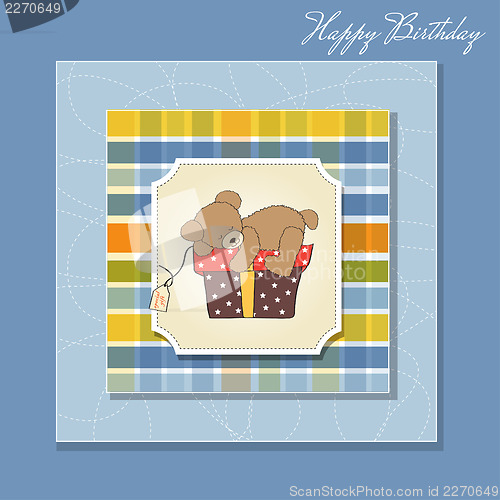 Image of birthday greeting card with teddy bear and big gift box