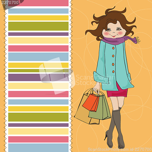Image of beautiful young woman at shopping
