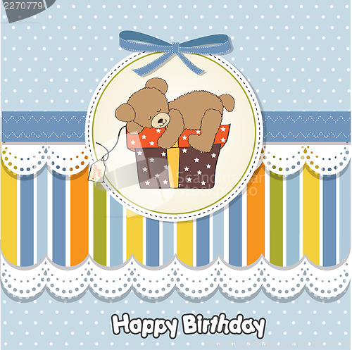 Image of birthday greeting card with teddy bear and big gift box