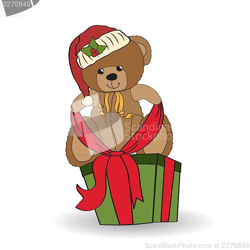 Image of cute teddy bear with a big Christmas gift box