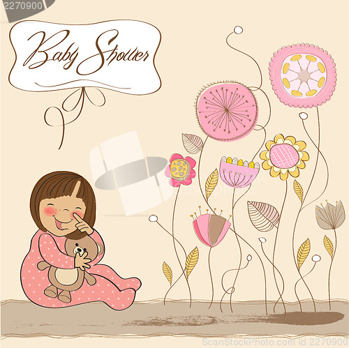 Image of little baby girl play with her teddy bear toy