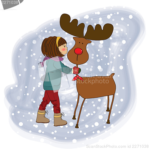 Image of Christmas card with cute little girl caress a reindeer