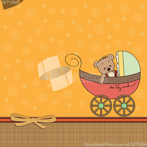 Image of funny teddy bear in stroller