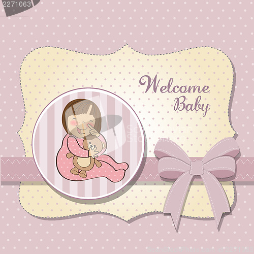 Image of little baby girl with her teddy bear toy