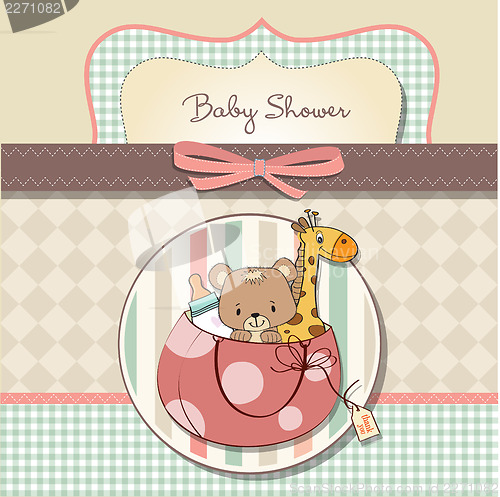 Image of new baby announcement card with bag and same toys