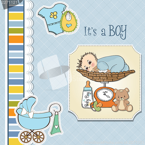 Image of baby boy weighed on the scale