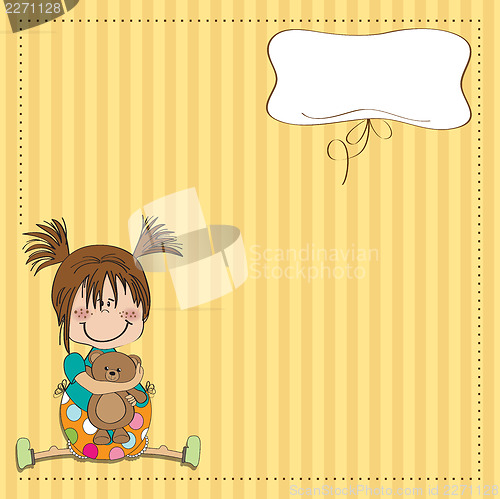 Image of little girl sitting with her teddy bear
