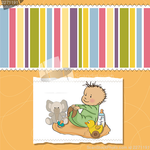 Image of little baby boy play with his toys