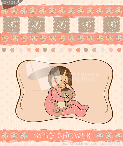 Image of little baby girl play with her teddy bear toy