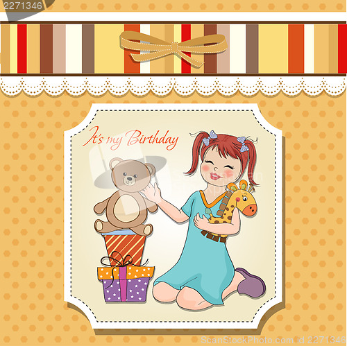 Image of little girl playing with her birthday gifts . happy birthday car