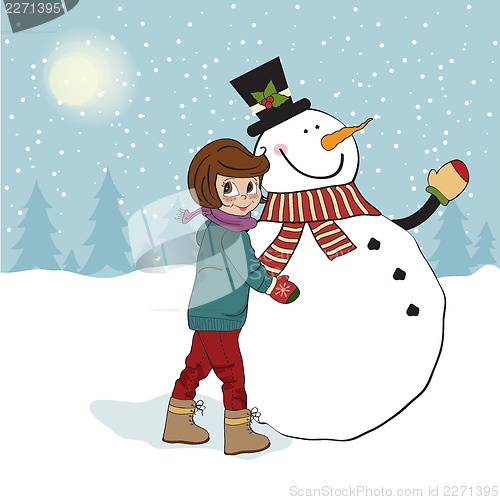 Image of Cute little girl with snowman