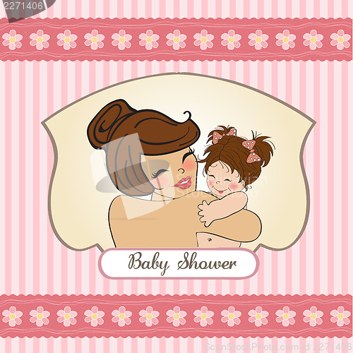 Image of young mother holding a new baby girl