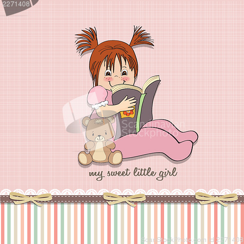 Image of sweet little girl reading a book