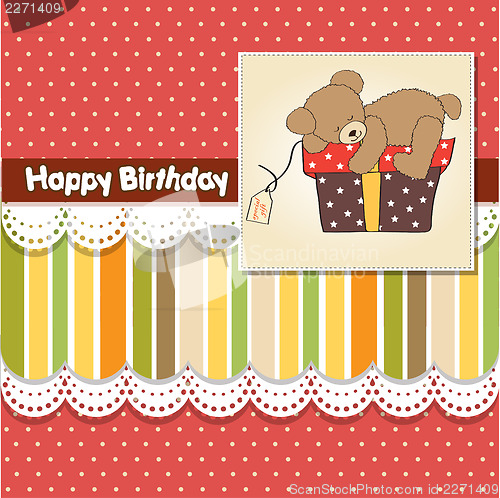 Image of birthday greeting card with teddy bear and big gift box