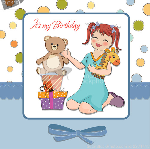Image of little girl playing with her birthday gifts . happy birthday car