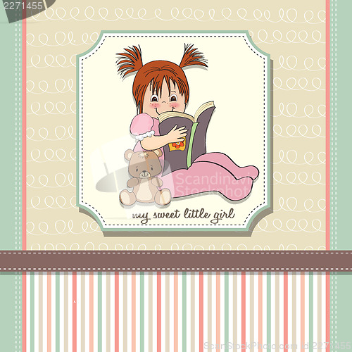Image of sweet little girl reading a book
