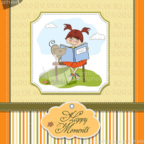 Image of young sweet girl reading a book