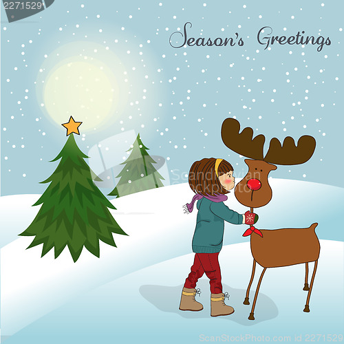 Image of Christmas card with cute little girl caress a reindeer