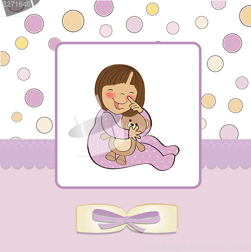 Image of little baby girl with her teddy bear toy