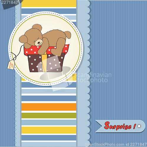 Image of birthday greeting card with teddy bear and big gift box