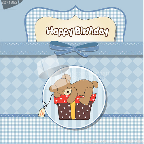 Image of birthday greeting card with teddy bear and big gift box