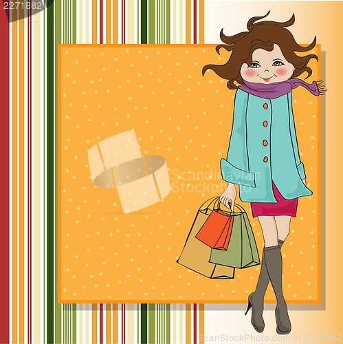 Image of beautiful young woman at shopping