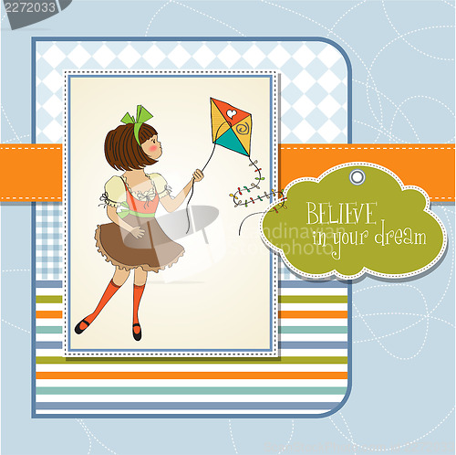 Image of cute teens who are playing with a kite