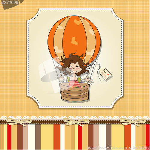 Image of happy girl flying with a balloon flying