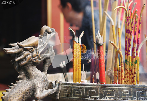 Image of Incense burning at a temple.