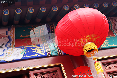 Image of Bright red lantern hanging at a temple